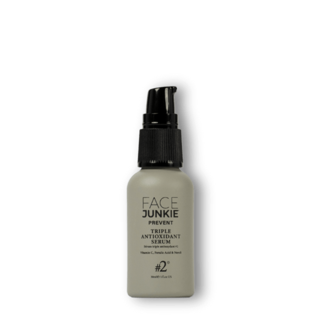 Face Junkie Triple Antioxidant Serum in a sleek, minimalist pump bottle. Powered by vitamin C, ferulic acid, and neroli, this potent serum helps brighten skin, neutralise free radicals, and combat environmental stressors. Designed for daily use, Face Junkie’s antioxidant-rich formula promotes a youthful, radiant complexion while preventing premature ageing through clean beauty and high-performance skincare.