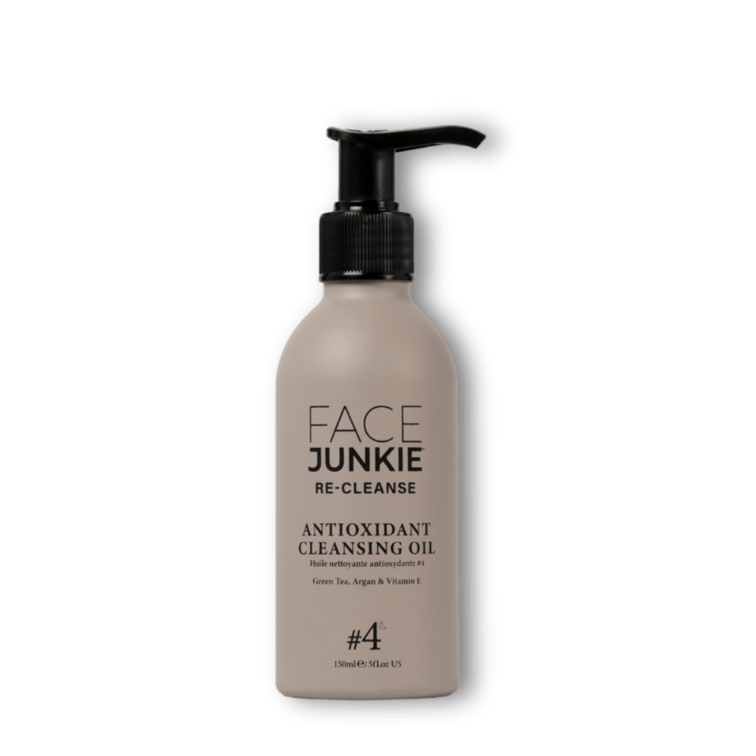 Face Junkie Antioxidant Cleansing Oil in a sleek, minimalist pump bottle. Formulated with green tea, argan oil, and vitamin E, this nourishing cleansing oil effectively removes makeup, impurities, and excess sebum while hydrating and protecting the skin. Designed for deep cleansing and skin renewal, Face Junkie’s antioxidant-rich formula supports a healthy, radiant complexion as part of a clean beauty skincare routine.