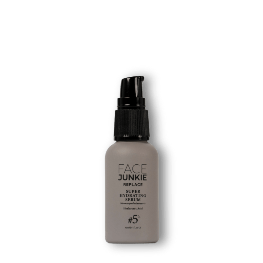 Face Junkie Super Hydrating Serum in a sleek, minimalist bottle with a black pump dispenser. Infused with hyaluronic acid, this lightweight serum deeply hydrates, plumps, and restores moisture balance for a radiant complexion. Part of Face Junkie’s clean beauty line, this serum is designed to nourish and rejuvenate the skin, promoting a healthy, dewy glow through high-performance, plant-powered skincare.